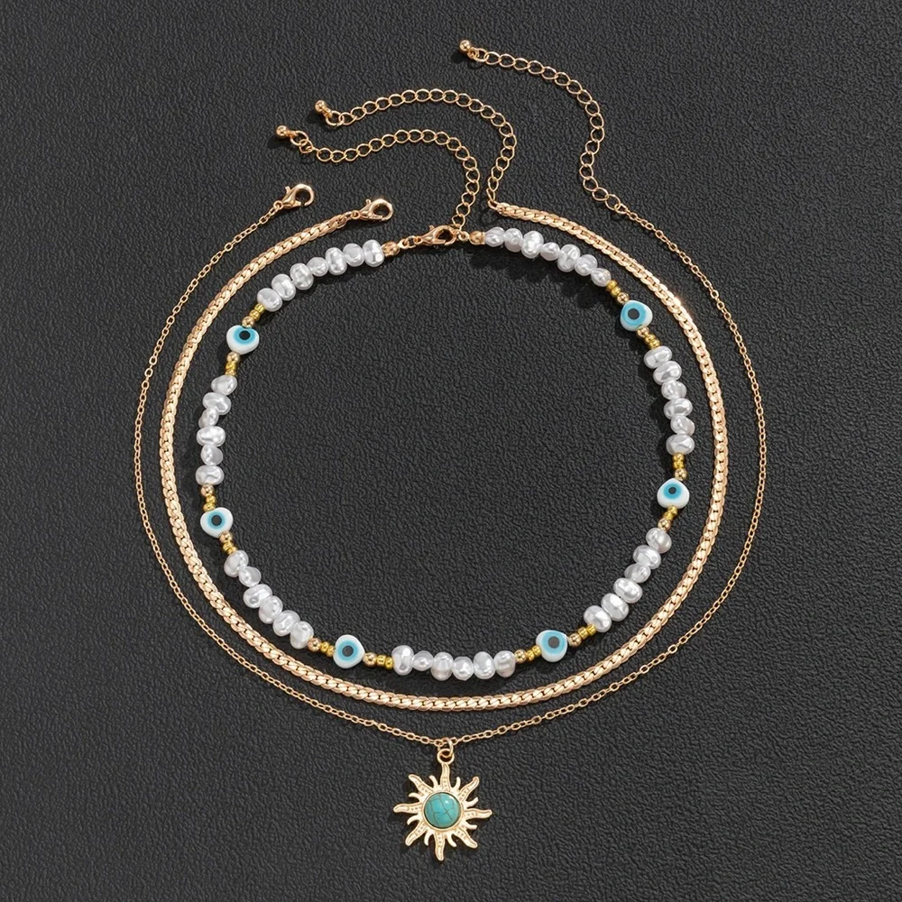 Anthropologie Gold Sun Pendant with White Pearls & Turquoise Accents